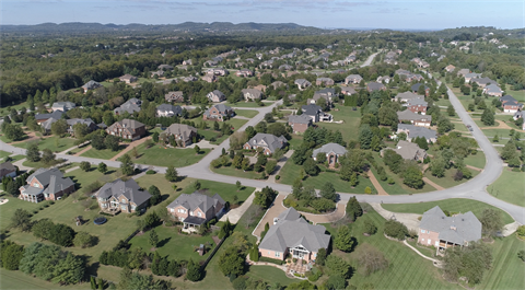 Aerial view of neighborhood in Brentwood with one acre lots.