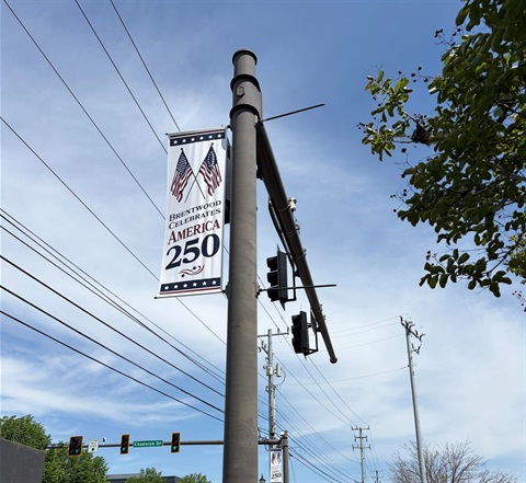 An America 250 Street Pole Banner for the City of Brentwood, hanging on Franklin Road.